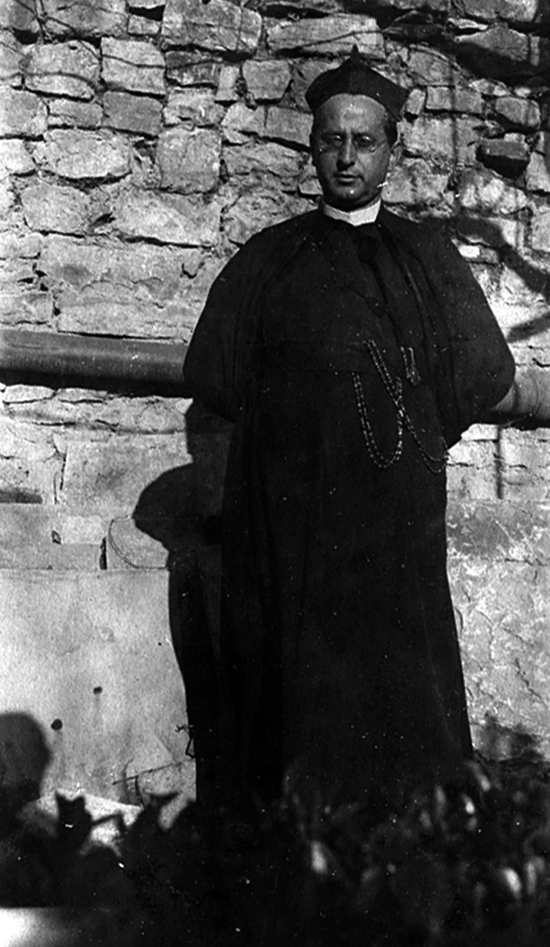 The 1918 photograph in front of the stone wall, restored.