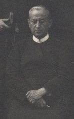 Fr Donato Jiménez seated with his hands folded, 1934.